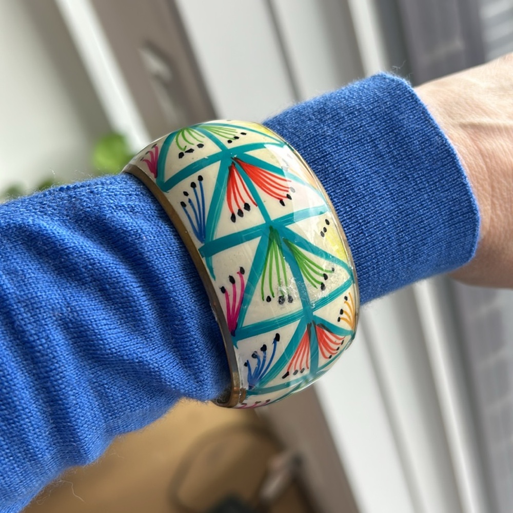 Vintage 1980s brass bangle with hand painted enamel on top